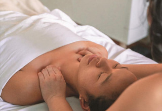 A person receives a relaxing massage at Campsite «La Nouvelle Croze» holiday park in Nouvelle-Aquitaine, France.