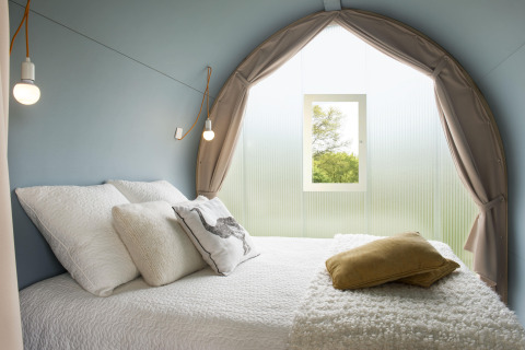 Interior view of the Coco Sweet safari tent at Ushuaïa Villages Le Viaduc campsite in France.