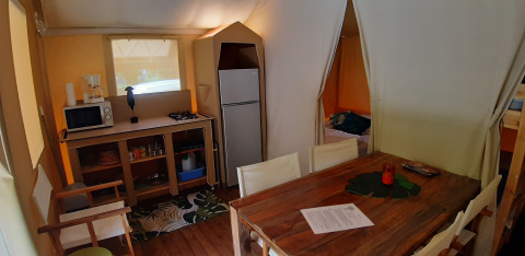 Interior of a safari tent named Jungle Lodge at Campsite Ushuaïa Villages Le Viaduc in France.
