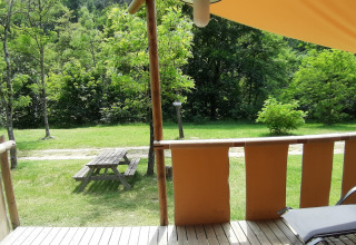 View from the terrace of a safari tent 'Jungle Lodge' at Ushuaïa Villages Le Viaduc campsite in France.