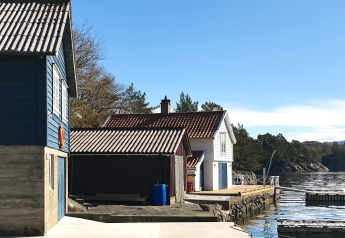 Foto del lodge '4 person holiday home in Reksteren' su una costa tranquilla in Danimarca.