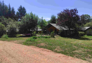 Glamping at Domaine la Chabanne – Safari tents in Auvergne-Rhône-Alpes, nestled among trees and nature.