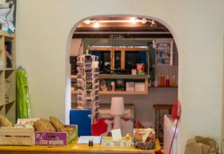 Interior of a camp shop at Camping Les Drouilhedes with shelves and local goods in Occitanie, France.