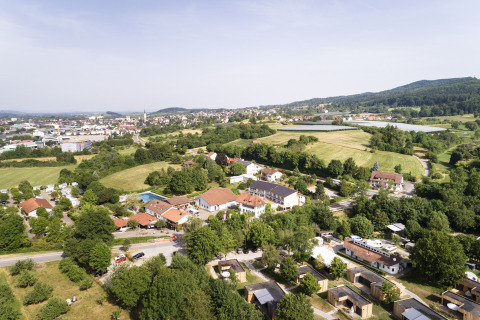 Aerial view of Wirthshof Resort, featuring comfort chalets and camping by Lake Constance in Germany.