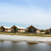 Waterfront glamping accommodation with luxury safari tents at Strandpark De Zeeuwse Kust in Zeeland.