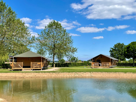 Glamping accommodation by the water with Ranger Lodges at De Betuwse Hofjes in Gelderland, Netherlands.