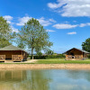 Glamping accommodation by the water with Ranger Lodges at De Betuwse Hofjes in Gelderland, Netherlands.