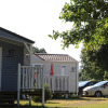 Glamping accommodation at Camping Tunisee - Stacaravans Baden-Württemberg featuring cabins and parked cars.
