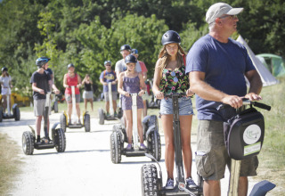 Group of people on Segway tour at Village Huttopia Dieulefit – Glamping Drôme-Provence, enjoying nature trails.