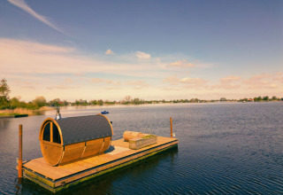 Wooden pod on a floating platform by the lake at Pean Buiten - Natuurhuisjes Friesland, glamping in Holland.