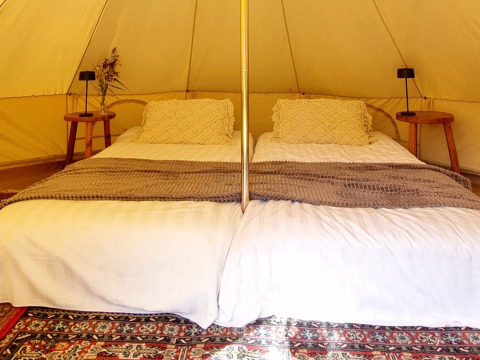 Glamping accommodation with two cozy beds and rustic decor in Sävö Bed and Breakfast, Södermanland.