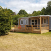 Glamping accommodation with wooden deck and modern cabin at Luxe Camping Borken am See in North Rhine-Westphalia.