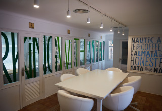 Modern common dining or lounge area at Camping Nautic Almata – Glamping Costa Brava, brightly decorated.