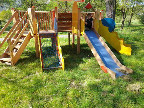 Playground with slide and climbing frame at Gorges de la Meouge - Hut Lodges Provence-Alpes-Côte d'Azur glamping site.