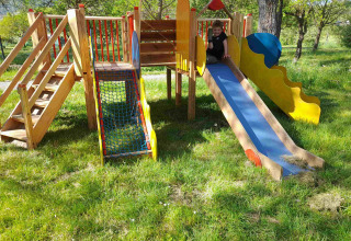 Playground with slide and climbing frame at Gorges de la Meouge - Hut Lodges Provence-Alpes-Côte d'Azur glamping site.