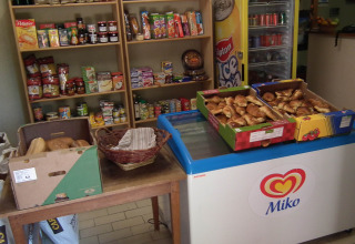 Small shop with croissants, bread, groceries, and drinks at Gorges de la Meouge Hut Lodges in Provence, France.
