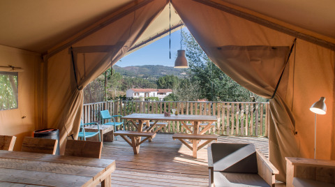 Luxury safari tent with wooden terrace and countryside views at Quinta do Cascalhal, Braga, glamping site.
