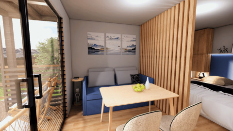 Alojamiento glamping moderno en Glamping Village Kötschach - Boomhutten Karinthië con terraza y decoración acogedora.