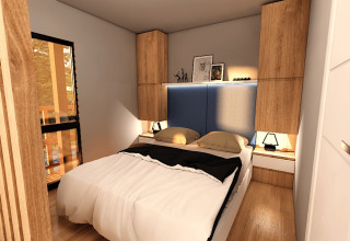 Chambre à Glamping Village Kötschach - Boomhutten Karinthië, mobilier moderne en bois et éclairage doux.