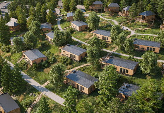 Glamping Village Kötschach met luxe stacaravans in Karinthië, omgeven door groen en bosrijke wandelpaadjes.