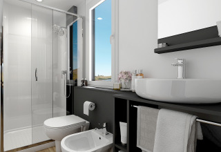 Baño moderno con ducha, lavabo, inodoro y bidé en Glamping Village Kötschach - Luxe stacaravans Karinthië.