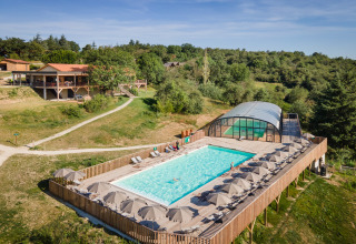 Aerial view of Village Huttopia Pays de Condrieu Glamping in Auvergne-Rhône-Alpes with pool and nature.