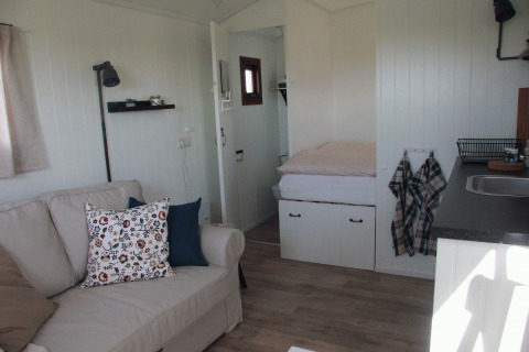 Interior of cozy accommodation at Campingplatz am Nordseestrand - Zigeunerwagen Oost-Friesland in the Netherlands.