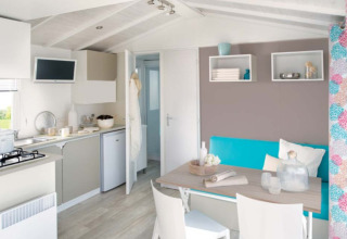 Modern glamping accommodation at Camping Alf - Chalets Rijnland-Palts with bright dining and kitchen area.