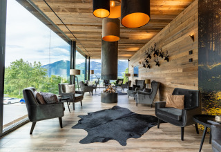 Modern lounge at Alpencamping Nenzing - Premium chalet in Voralberg with mountain view and cozy decor.
