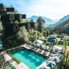 View of Alpencamping Nenzing with premium chalet cabins, swimming pool and mountain scenery in Vorarlberg.