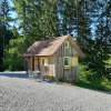 Small wooden glamping cabin called Gallushof, located in Baden-Württemberg’s countryside, surrounded by forest.