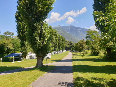 Camping Bellinzona in Switzerland offers glamping and camping, surrounded by mountains and green fields.