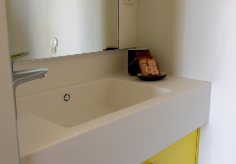 Modern white sink and mirror at Strandcamping Podersdorf am See - Tiny Houses, Austria glamping.