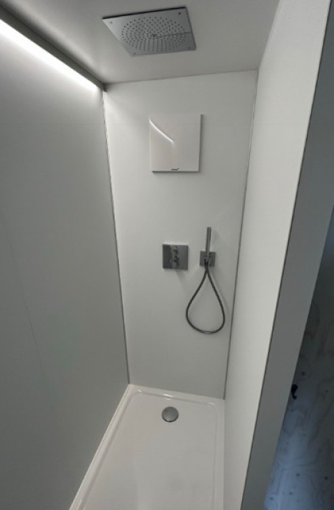 Modern shower cabin in glamping accommodation at Strandcamping Podersdorf am See - Tiny Houses, Austria.