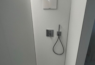 Modern shower cabin in glamping accommodation at Strandcamping Podersdorf am See - Tiny Houses, Austria.