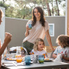 Family enjoying breakfast outdoors at Falkenstein Premium Camping Zadar - Mobile Homes in Dalmatia.