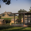 Glamping at Camping Huttopia Pays de Cordes Sur Ciel with scenic village view in Occitanie countryside.