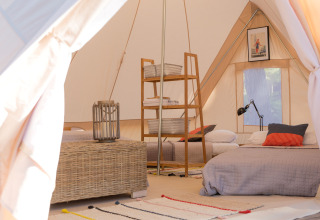 Interior of a glamping tent at Camping Ca Savio - Nordisk Village Venice, cozy beds and stylish decor.