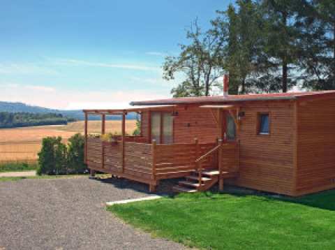 Glamping accommodation at Ferienanlage Erzeberg - Blockhütten Hessen, a cozy wooden cabin in a natural setting.