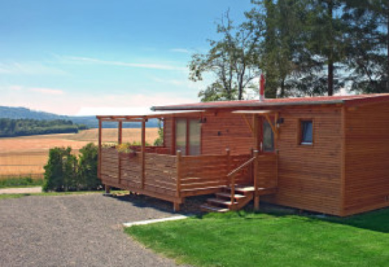 Glamping accommodation at Ferienanlage Erzeberg - Blockhütten Hessen, a cozy wooden cabin in a natural setting.