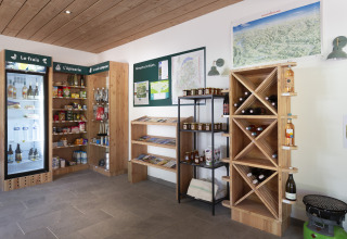 Shop with local products and maps at Huttopia Vanoise – Bozel – Glamping Savoie accommodation in France.