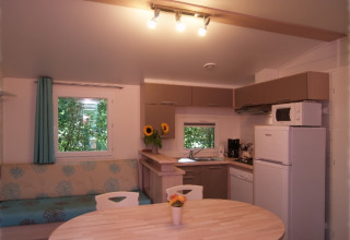 Modern glamping accommodation kitchen and dining area at Eifelidyll - Luxe kamperen, Rhineland-Palatinate.
