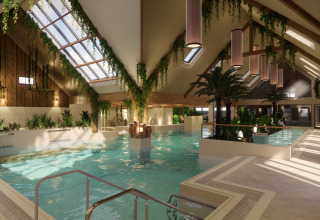 Indoor pool area at Camping Saint Pabu Plage - Glamping Bretagne, filled with lush plants and skylights.