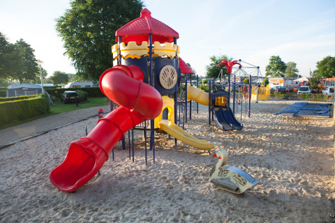 Playground with slides and sand at Vakantiepark De Oude Molen - Safaritent Gelderland camping site.
