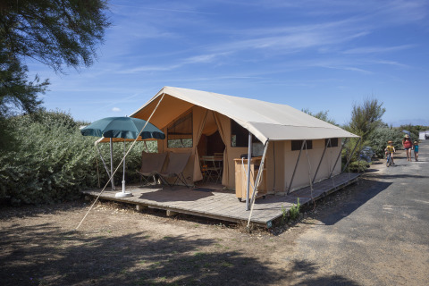 Glamping accommodation at Huttopia Côte Sauvage - Ile de Ré - Glamping Nouvelle-Aquitaine with tent and deck.