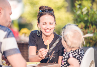 Guests eat fries - Ackersate Villatent - Voorthuizen, Gelderland, Netherlands