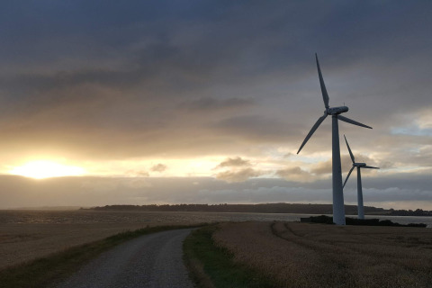 Vindmøller ved solnedgang i nærheden af '5 star holiday home in Sydals', en rolig scene i Danmark.