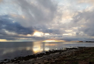 Vista mare al tramonto vicino alla casa vacanze per 6 persone a Bogense, Danimarca.