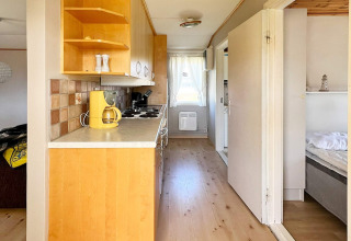 Narrow kitchen hallway inside a 5 person holiday home in Skummeslövsstrand, Sweden, with bedroom.