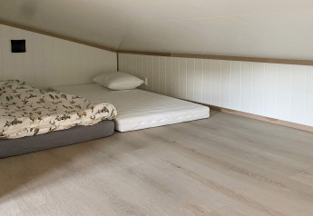 Simple loft room at 5 star holiday home in stokmarknes, Sweden, with mattresses placed on the floor.